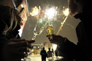 Two women toast as fireworks explodes - New Year Party